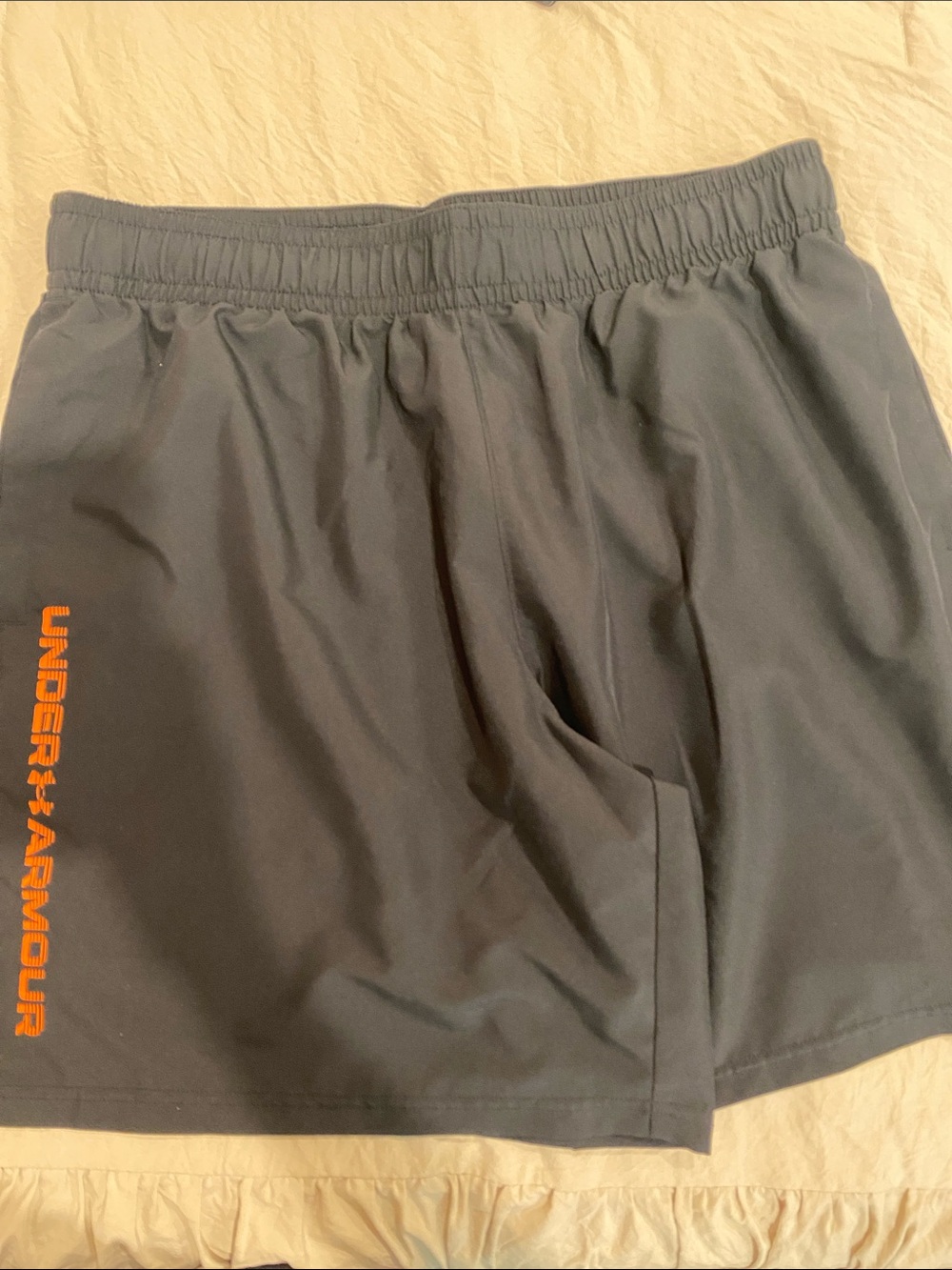 Under Armour Men's Black Athletic Shorts with Orange Vertical Logo